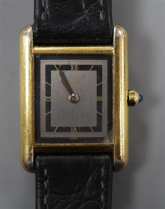 A ladys gilt white metal Cartier Vermeil Tank quartz wrist watch.
